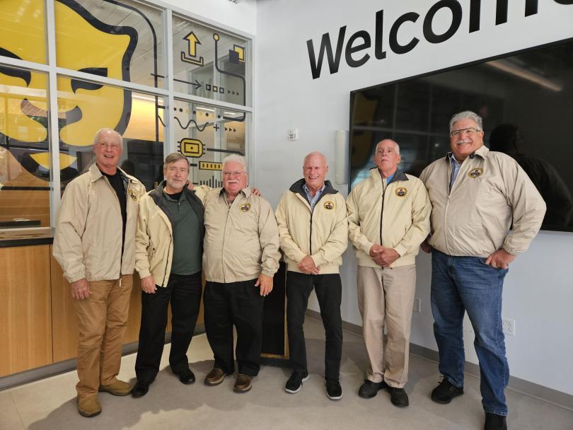 A group of men in jackets