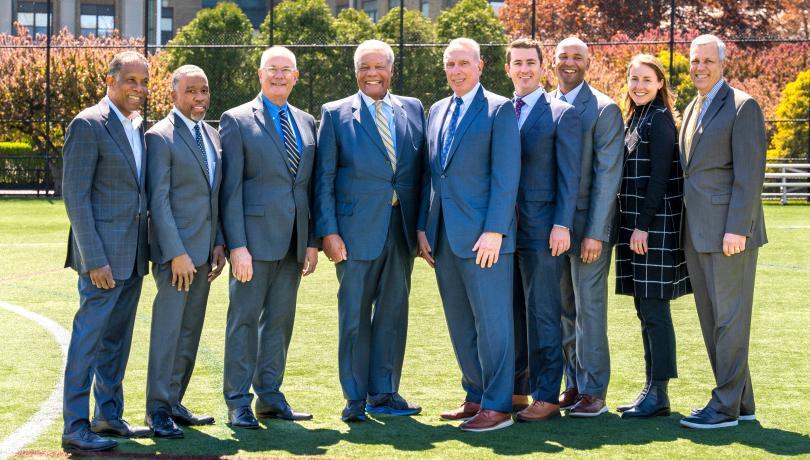 Members of Huntington Development Group pose on the athletic field