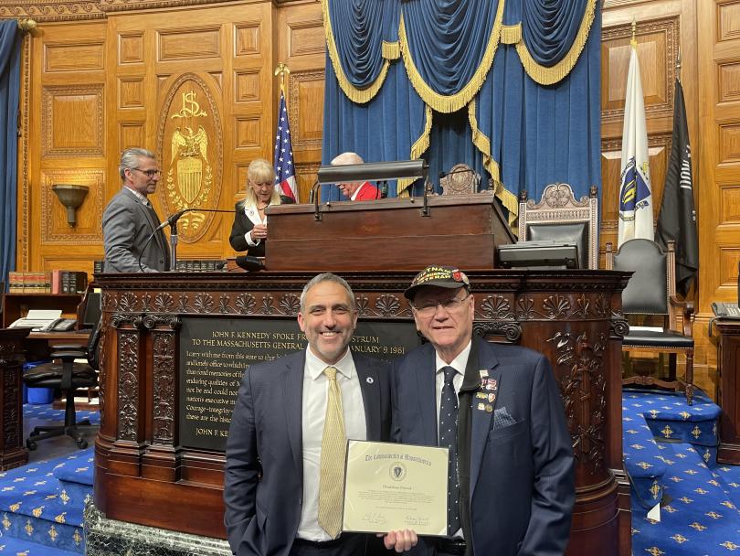 Two gentlemen holding a certificate